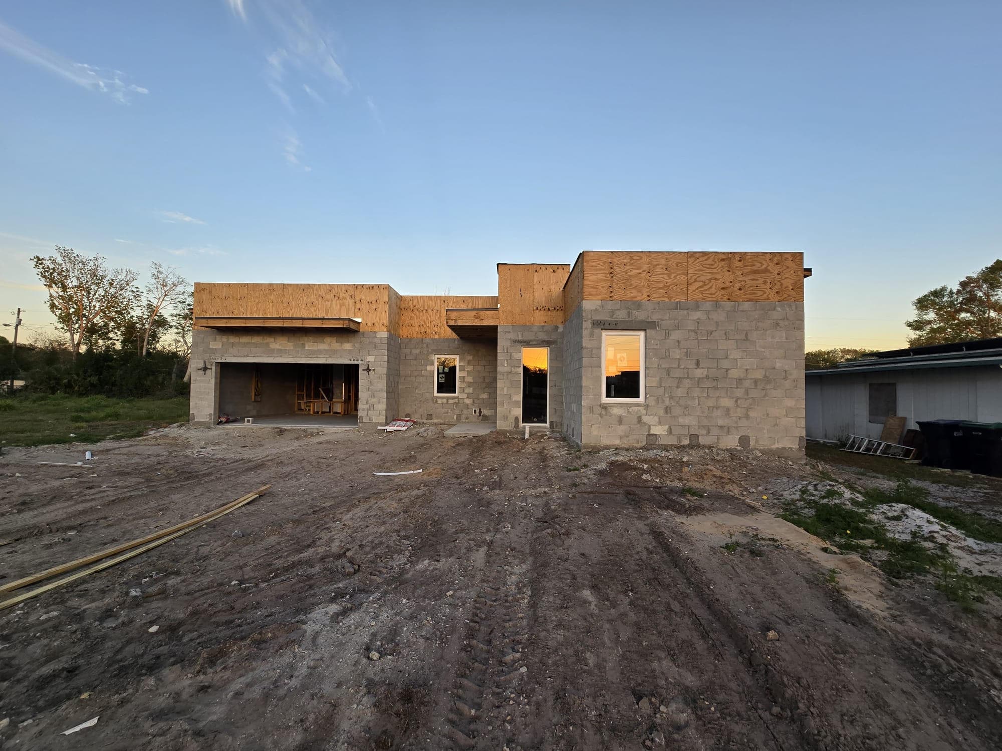 Newly constructed home with unfinished exterior and wooden framework